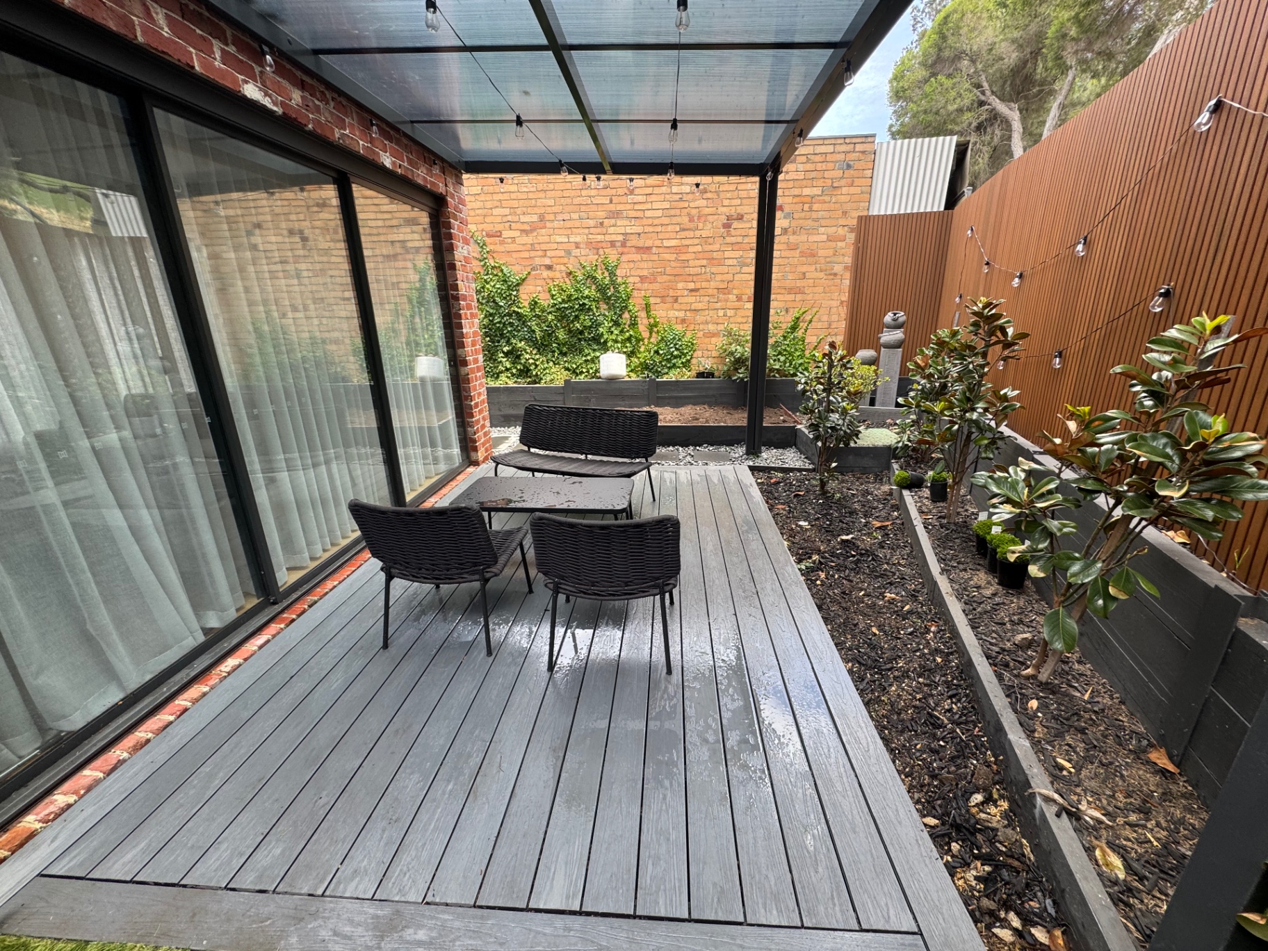 Custom composite deck with backyard renovation